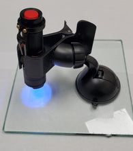 Load image into Gallery viewer, UV curing flashlight and suction cup holder on glass pane