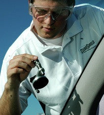 male technician using windshield repair bridge